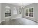 Formal dining room with arched doorways and large windows at 8820 Waynick Dr, Raleigh, NC 27617