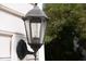 Close-up of a vintage-style exterior light fixture at 8820 Waynick Dr, Raleigh, NC 27617