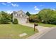 Charming two-story home with a well-maintained lawn, attached garage, and classic architectural details at 8820 Waynick Dr, Raleigh, NC 27617