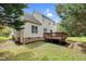 Back of home with wooden deck and beautiful lawn at 8820 Waynick Dr, Raleigh, NC 27617