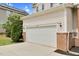 Attached two-car garage on a charming two-story home with a well-maintained lawn at 8820 Waynick Dr, Raleigh, NC 27617