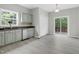 Bright kitchen and breakfast area with stainless steel appliances and access to deck at 8820 Waynick Dr, Raleigh, NC 27617