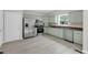 The updated kitchen features stainless steel appliances and ample cabinet space at 8820 Waynick Dr, Raleigh, NC 27617