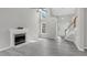 Bright living room with high ceilings, fireplace, and large windows at 8820 Waynick Dr, Raleigh, NC 27617