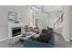 Bright living room showcasing a fireplace, vaulted ceiling, and stylish decor at 8820 Waynick Dr, Raleigh, NC 27617