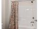 Bathroom with a shower-tub combination and decorative shower curtain at 904 Palm Ct, Mebane, NC 27302