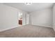 Spacious bedroom with plush carpeting, and an open doorway to the Primary bathroom at 904 Palm Ct, Mebane, NC 27302