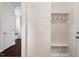 Inviting entryway with coat rack and bench, hardwood flooring, and white painted door at 904 Palm Ct, Mebane, NC 27302