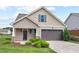 Charming home with a two-car garage, well-maintained lawn, and attractive landscaping at 904 Palm Ct, Mebane, NC 27302