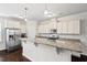 Bright kitchen with granite countertops, stainless steel appliances, and ample cabinet space at 904 Palm Ct, Mebane, NC 27302