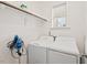 Laundry room with window, shelving, rod, and newer washer and dryer at 904 Palm Ct, Mebane, NC 27302