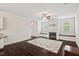 Cozy living room featuring a fireplace, hardwood floors, and built-in bench seating at 904 Palm Ct, Mebane, NC 27302