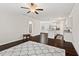 Open-concept living room and kitchen area with hardwood floors and neutral colors at 904 Palm Ct, Mebane, NC 27302