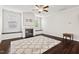 Cozy living room featuring a fireplace, hardwood floors, and built-in bench seating at 904 Palm Ct, Mebane, NC 27302