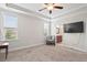 Large main bedroom has a ceiling fan, and doorway leading to main bathroom at 904 Palm Ct, Mebane, NC 27302