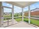 Screened back porch with view of backyard and neighboring houses at 904 Palm Ct, Mebane, NC 27302