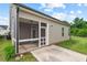 Back exterior of home showing screened porch with exterior siding and manicured yard at 904 Palm Ct, Mebane, NC 27302