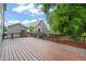 Large wooden deck with dark railings, perfect for outdoor entertaining, overlooks the backyard at 905 E Lenoir St, Raleigh, NC 27610