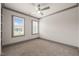 Spacious bedroom with neutral color scheme, carpeted floor, ceiling fan and windows with plantation shutters at 905 E Lenoir St, Raleigh, NC 27610