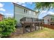 Exterior view of a two-story home featuring a back deck, covered patio, and well-maintained lawn at 905 E Lenoir St, Raleigh, NC 27610