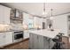 Modern kitchen with a large island, stainless steel appliances, and pendant lighting at 905 E Lenoir St, Raleigh, NC 27610