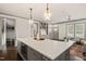 Spacious kitchen island with seating and an open layout to the living area at 905 E Lenoir St, Raleigh, NC 27610