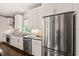 Well-appointed kitchen with stainless steel refrigerator and ample counter space at 905 E Lenoir St, Raleigh, NC 27610