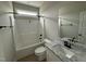 Practical bathroom featuring a shower-tub combo, a neutral vanity with a new sink, and updated fixtures at 94 Royal Ave, Selma, NC 27576