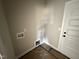 Dedicated laundry room features convenient hookups and ample space for laundry appliances and storage at 94 Royal Ave, Selma, NC 27576