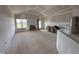 Spacious living room with high ceilings and large windows, ready for customization at 94 Royal Ave, Selma, NC 27576