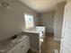 Elegant primary bathroom with double vanities, soaking tub, and modern fixtures, creating a spa-like experience at 94 Royal Ave, Selma, NC 27576
