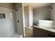 Tastefully designed primary bathroom featuring a sleek shower with modern tile and stylish vanity at 94 Royal Ave, Selma, NC 27576