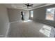 Serene primary bedroom with tray ceiling, abundant natural light, and ensuite bathroom access at 94 Royal Ave, Selma, NC 27576