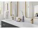 Modern bathroom featuring double sinks, gold fixtures, and stylish decor for a luxurious feel at 1010 Cobb St, Durham, NC 27707