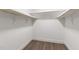 Walk-in closet with ample shelving and wood flooring, offering plenty of storage space at 1010 Cobb St, Durham, NC 27707