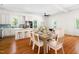 Inviting dining area featuring a modern table setting and seamless transition to an open kitchen and living space at 1010 Cobb St, Durham, NC 27707