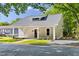 Charming home featuring a covered porch with white columns and a landscaped front yard at 1010 Cobb St, Durham, NC 27707