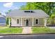 Charming home featuring a covered porch with white columns and a landscaped front yard at 1010 Cobb St, Durham, NC 27707