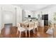 Open concept dining room and kitchen with wood floors and stainless steel appliances at 1010 Cobb St, Durham, NC 27707