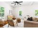 Cozy living room with large windows, comfortable seating, and bright interior design at 1010 Cobb St, Durham, NC 27707