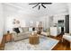 Open concept living area with hardwood floors, comfortable seating, and modern design at 1010 Cobb St, Durham, NC 27707