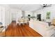 Open concept living area with hardwood floors, dining area, and modern kitchen at 1010 Cobb St, Durham, NC 27707