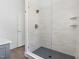 Modern shower stall with sleek white tiles, gold accents, and a glass enclosure at 1010 Cobb St, Durham, NC 27707