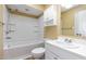 Bathroom featuring a tub/shower combo, white vanity, cabinet, and neutral wall paint at 1015 Boathouse Ct, Raleigh, NC 27615