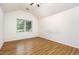 Bedroom featuring a large window and wood floors at 1015 Boathouse Ct, Raleigh, NC 27615