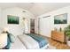 Comfortable bedroom with art, natural light, and ample closet space at 1015 Boathouse Ct, Raleigh, NC 27615