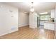 Dining area with wood floors and modern lighting at 1015 Boathouse Ct, Raleigh, NC 27615