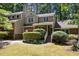Charming home boasts a brick and siding exterior, complemented by lush greenery and a neatly kept lawn at 1015 Boathouse Ct, Raleigh, NC 27615