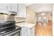 Kitchen featuring white cabinets and stainless appliances at 1015 Boathouse Ct, Raleigh, NC 27615