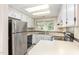 Spacious kitchen featuring stainless appliances and white cabinets at 1015 Boathouse Ct, Raleigh, NC 27615